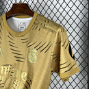 Camisa Real Madrid Treino 2025/26 - Adidas Torcedor Masculina - Dourada/Preta