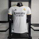 Camisa Pronta Entrega Real Madrid Home 2023/24 - Adidas Jogador Masculina - Branca/Azul + Patchs Champions League